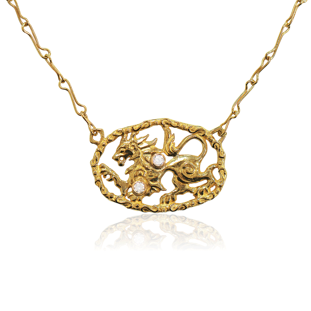 Gold necklace with a lion pendant on a white background